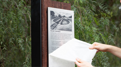 A stainless steel and redgum wayfinding sign being installed for an Australian Council.